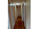 Hallway showcasing hardwood floors and neutral paint at 2479 Kingsland Dr, Dunwoody, GA 30360