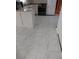 Kitchen area featuring white tile floors and Stainless Steel refrigerator at 2479 Kingsland Dr, Dunwoody, GA 30360