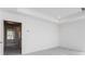 Bedroom with neutral walls, carpet, natural light, and a glimpse into an adjacent room at 3256 Durston Ct, Dacula, GA 30019