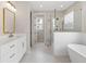 Spa-like bathroom with soaking tub, walk-in shower, and double vanity at 517 Pearl St, Cumming, GA 30040