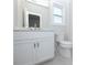 Modern bathroom with white vanity, toilet and tile flooring at 517 Pearl St, Cumming, GA 30040