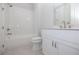 Clean bathroom with white vanity, shower/tub combo, and tile flooring at 517 Pearl St, Cumming, GA 30040