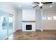 Living room fireplace with shiplap wall and wood mantel at 517 Pearl St, Cumming, GA 30040