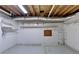 Unfinished basement with shelving and ample storage space at 947 Pinbrook Dr, Lawrenceville, GA 30043