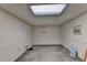 Unfinished basement with light and wall shelving at 947 Pinbrook Dr, Lawrenceville, GA 30043