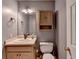 Small bathroom with toilet, sink, and vanity at 947 Pinbrook Dr, Lawrenceville, GA 30043