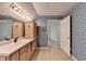 Bathroom with single sink and built-in cabinets at 947 Pinbrook Dr, Lawrenceville, GA 30043