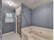 Bathroom with shower and bathtub at 947 Pinbrook Dr, Lawrenceville, GA 30043