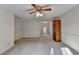 Spacious bedroom with a ceiling fan and window at 947 Pinbrook Dr, Lawrenceville, GA 30043