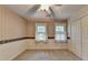 Bedroom with two windows, carpet, and ceiling fan at 947 Pinbrook Dr, Lawrenceville, GA 30043