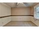 Bedroom with window, carpet, and ceiling fan at 947 Pinbrook Dr, Lawrenceville, GA 30043