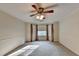 Spacious bedroom with a ceiling fan and window at 947 Pinbrook Dr, Lawrenceville, GA 30043