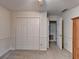 Bedroom with double door closet and access to bathroom at 947 Pinbrook Dr, Lawrenceville, GA 30043