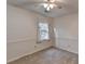 Bright bedroom with carpet flooring, ceiling fan, and window at 947 Pinbrook Dr, Lawrenceville, GA 30043