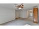 Spacious bedroom with a ceiling fan and window at 947 Pinbrook Dr, Lawrenceville, GA 30043