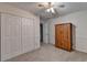 Bedroom with double door closet and wood cabinet at 947 Pinbrook Dr, Lawrenceville, GA 30043