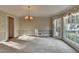 Formal dining room with bay window and chandelier at 947 Pinbrook Dr, Lawrenceville, GA 30043