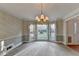 Formal dining room with bay window and chandelier at 947 Pinbrook Dr, Lawrenceville, GA 30043