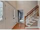 Two-story entryway with hardwood floors and staircase at 947 Pinbrook Dr, Lawrenceville, GA 30043