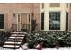 Brick front entrance with steps leading to a double door at 947 Pinbrook Dr, Lawrenceville, GA 30043