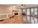Gathering room with hardwood floors and brick fireplace at 947 Pinbrook Dr, Lawrenceville, GA 30043