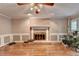 Gathering room with hardwood floors and brick fireplace at 947 Pinbrook Dr, Lawrenceville, GA 30043