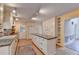 Open kitchen with island and white cabinets at 947 Pinbrook Dr, Lawrenceville, GA 30043