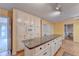Island kitchen with granite countertops and white cabinets at 947 Pinbrook Dr, Lawrenceville, GA 30043