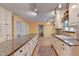 Open kitchen with large island and white cabinets at 947 Pinbrook Dr, Lawrenceville, GA 30043