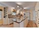 Spacious kitchen with island, ample cabinetry, and granite countertops at 947 Pinbrook Dr, Lawrenceville, GA 30043