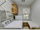 Laundry room with washer, dryer, and cabinets at 947 Pinbrook Dr, Lawrenceville, GA 30043