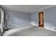 Spacious living room with light blue walls and large window at 947 Pinbrook Dr, Lawrenceville, GA 30043