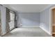 Spacious living room with light blue walls and large window at 947 Pinbrook Dr, Lawrenceville, GA 30043