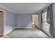 Spacious living room with hardwood floors and a view into another room at 947 Pinbrook Dr, Lawrenceville, GA 30043