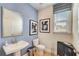 Small powder room with pedestal sink, toilet, and light blue walls at 131 Bennett Farm Dr, Loganville, GA 30052