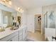 Double vanity bathroom with a large shower and soaking tub at 131 Bennett Farm Dr, Loganville, GA 30052