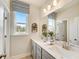 Clean bathroom with double vanity and updated fixtures at 131 Bennett Farm Dr, Loganville, GA 30052