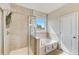 Spa-like bathroom with soaking tub, shower, and double vanity at 131 Bennett Farm Dr, Loganville, GA 30052