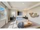 Main bedroom with a king-size bed and plenty of natural light at 131 Bennett Farm Dr, Loganville, GA 30052