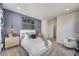 Spacious bedroom with a large bed, dresser, and plenty of natural light at 131 Bennett Farm Dr, Loganville, GA 30052