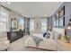 Main bedroom with a dresser, a large bed, and a stunning accent wall at 131 Bennett Farm Dr, Loganville, GA 30052