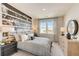 Secondary bedroom with wood dresser and large mirror at 131 Bennett Farm Dr, Loganville, GA 30052
