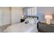 Cozy bedroom with calming blue wall and natural light at 131 Bennett Farm Dr, Loganville, GA 30052