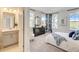 Bright bedroom with ensuite bathroom and plenty of natural light at 131 Bennett Farm Dr, Loganville, GA 30052