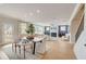 Open concept dining area with view to kitchen and living room at 131 Bennett Farm Dr, Loganville, GA 30052