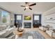 Great room with a fireplace, ample natural light, and a neutral color palette at 131 Bennett Farm Dr, Loganville, GA 30052