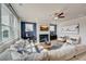Open concept great room featuring a fireplace, sectional sofa, and hardwood floors at 131 Bennett Farm Dr, Loganville, GA 30052
