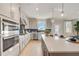 Modern kitchen with stainless steel appliances and white cabinets at 131 Bennett Farm Dr, Loganville, GA 30052