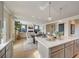 Bright kitchen boasts an expansive island and an open layout to the living area at 131 Bennett Farm Dr, Loganville, GA 30052