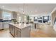 Open concept kitchen features a large island, stainless steel appliances, and stylish cabinetry at 131 Bennett Farm Dr, Loganville, GA 30052
